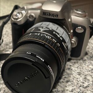 Nikon Silver Camera with Black Lens